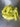 A few light yellow-green peppers, similar to those grown from Hungarian Wax Seeds, sit on a stainless steel surface—one pepper's skin is split, showing their medium heat and flavor.