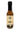 A bottle of Smokin' Ed's Harissa - Hot with a beige label, black cap, flame graphics, and five-pepper heat—a bold, flavorful spicy pepper sauce for heat lovers.