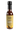 A bottle of Smokin' Ed's Oh Boy! Garlic Soy - Pepper X Edition is a dark brown, spicy sauce featuring Pepper X heat, a yellow label with Smokin Ed’s World Famous Peppers, and comes with a black cap.