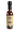A 5 fl oz (148 mL) bottle of Smokin' Ed's Harissa - Mild hot sauce with a beige label featuring flames at the bottom, black text, and a black cap. This sauce blends mild harissa and chili powder.
