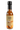 A glass bottle of Smokin' Ed's Aprichot Sauce- Hot, featuring a bold apricot hot sauce with an orange label, flame graphics, black cap, chili pepper logo, and a heat level indicator showing five flaming icons.