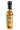 A 5 fl oz (148 mL) glass bottle of Smokin' Ed's Tahini - Mild features a black cap and beige label with flames and a pepper logo. This mild hot sauce combines creamy tahini with subtle heat for a unique flavor.