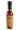 A bottle of Smokin' Ed's Tamarind - Hot with a black cap and tan label featuring chili pepper and flame graphics, delivering tangy tamarind flavor and fiery heat from world-famous chile peppers.