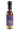 A bottle of Smokin' Ed's Unique Garlique hot sauce with a purple label, yellow flames at the bottom, a black cap, and fiery chili peppers, inspired by the legendary Smokin' Ed Currie.