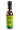 A glass bottle of Smokin' Ed's Verde - Mild, with a green label featuring flames and a pepper logo, contains brownish-green savory hot sauce and is topped with a black cap.