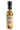 A glass bottle of Smokin' Ed's Dumpling - Mild sauce with a black cap and beige label featuring a pepper logo, flames at the bottom, and "World Famous Peppers"—a tasty mild dumpling sauce made with real chile peppers.