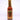 A 5 fl oz bottle of Hell's Kitchen Ginger Devil hot sauce, made with 7 pot primo and fatalli peppers, finished with a gold cap and a yellow label featuring red and gold flame graphics.