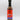 A bottle of Smokin' Ed's British Brown - Mild sauce with a black cap, red and blue label, flames graphic, and “Mild British Brown Sauce” text. This mild condiment offers unique flavors against a white background.