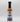 A bottle of Smokin' Ed's Korean Dumpling - Mild sauce, an orange-red mild chili sauce for Korean cuisine, featuring a black cap, white label with blue flames, and a logo above the product name.