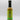 A bottle of Smokin' Ed's Mustard Dill - Pepper X Edition hot sauce, with a black cap and green label featuring flame graphics and branding, is displayed on a plain white background.