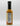 A bottle of Smokin' Ed's Shawarma - Hot with a black cap is shown on a plain white background, displaying the nutrition facts and ingredients on the back. The orange-yellow sauce inside features chili powder and garlic flavors.