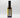 A bottle of Smokin' Ed's Spicy Malt Vinegar - Mild with a black cap and yellow label, shown from the back on a plain white background. The nutrition facts and ingredients list highlight chili powder and garlic powder.