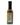A Smokin' Ed's Table - Pepper X sauce bottle with a black cap, featuring a yellow and green label, nutrition facts and ingredients on the back, set against a white background—suggesting its fiery flavor.