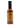 A bottle of Smokin' Ed's Tamarind - Mild hot sauce features a black cap, brown label with flame graphics, and white and orange text—ideal for anyone who enjoys a flavorful, mild hot sauce.