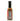 A bottle of Smokin' Ed's Wing Thing - Pepper X Edition hot sauce with a black cap is shown from the back, displaying its nutrition facts and ingredients on a white background. The medium brown spicy-sweet sauce inside is ideal for chicken wings.