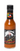 A bottle of Mikey V's Reaper Unleashed, with a dark label showcasing fiery graphics and a skeleton, delivers the intense heat of Carolina Reaper peppers.