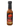 A bottle of Jersey Barnfire Ultra Hot Black Garlic hot sauce with a black cap, red barn logo, and bold flavor from extra hot 7-Pot Primos peppers—perfect as a hot sauce or unique steak sauce.