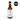 A bottle of Seed Ranch Umami Reserve Hot Sauce with a white label and ingredient text stands beside a circular AWARD WINNER badge on a plain white background.