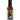 A bottle of Reaper Squeezins hot sauce with a black cap, featuring a label with a grim reaper illustration and text: “PuckerButt Pepper Co.,” “Reaper XXX,” and “For All Sauces.”.