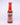 A 5 fl oz bottle of Hell's Kitchen West Side Red hot sauce features a red cap, bold red and blue label graphics, flavor descriptions, and the spicy heat of fresno and red habanero peppers.