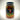 A 16 oz jar of Mikey V's XXX Spicy Reaper Pickles, featuring a chili pepper and Texas logo with flames on the label. Made with Carolina Reaper peppers, these pickles pack extra heat.