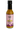 A bottle of Smokin' Ed's Mustard Passionfruit - Hot with a pink label, black cap, and yellow-orange sauce. The label has flame graphics and showcases the chili powder blend and bold spicy heat.