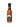 A bottle of Mikey V Reaper Unleashed hot sauce with a black cap and a fiery label showing a flaming skeleton, bold red and yellow text, and intense Carolina Reaper pepper flavor.