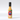 A yellow-orange bottle labeled "Colorful Colorado Creation- Roasted & Toasted," featuring mountains, the Colorado flag C, and crafted as a zesty fire roasted tomato sauce.
