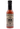 A bottle of Smokin’ Racha habanero hot sauce with a stylized skull and floral label, filled with vibrant reddish-orange spicy sriracha, finished with a black cap.