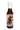 A bottle of Angry Goat Goat Rider hot sauce features a cartoon goat in sunglasses riding a motorcycle through flames, holding an American flag, capturing this ghost pepper sauce’s bold and fiery spirit.
