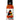 A bottle of Defcon Cluckwing Orange labeled "Extreme Heat," showing an illustrated man with a chili pepper, features Trinidad scorpion pepper in bold orange and black text on a white background.