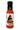 A bottle of Defcon Cluckwing Orange labeled "Extreme Heat," showing an illustrated man with a chili pepper, features Trinidad scorpion pepper in bold orange and black text on a white background.