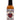 A 5 oz bottle of Bad Apple hot sauce features a red apple illustration and decorative text. This Smokin' Ed Currie creation blends sweet apple and cinnamon with reaper heat. The label shows the PuckerButt Pepper Company website.