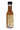 A bottle of Char Man Caribbean Hot Sauce with a label describing the Loogaroo, a vampire from Caribbean folklore, and a barcode at the bottom. Inside is an orange-brown sauce made from bold island spices.