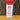 A 4.5 oz (128g) plastic shaker of White Wolf Rubs Arctic Savory Seasoning rests on a wooden surface with a rustic backdrop. The label recommends using it on vegetables, salads, meats, and as a flavorful hamburger rub.
