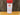 A 4.5 oz (128g) plastic shaker of White Wolf Rubs Arctic Savory Seasoning rests on a wooden surface with a rustic backdrop. The label recommends using it on vegetables, salads, meats, and as a flavorful hamburger rub.