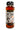 A 12-ounce bottle of Spicy Shark Hot Honey, infused with habanero, features a fire-breathing shark holding a honey dipper. The label says "Born in New England" and "Eat the Heat." Inside is rich, amber-colored spicy honey.