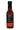 A bottle of Bravado Serrano & Basil is shown from the back, featuring the nutrition facts label, website, social media info, and a gluten-free symbol. The bottle contains reddish-brown sauce and has a black cap.