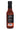 Bravado Serrano & Basil comes in a glass bottle with a black cap, bold deep red sauce, and a rear label listing ingredients. Perfect for adding zest to pizza or pasta. Best-by date and barcode are printed at the bottom.