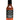 A bottle of Bravado Serrano & Basil hot sauce, with a black label, chili art, vegan and medium spice indicators—great for pizza or pasta.